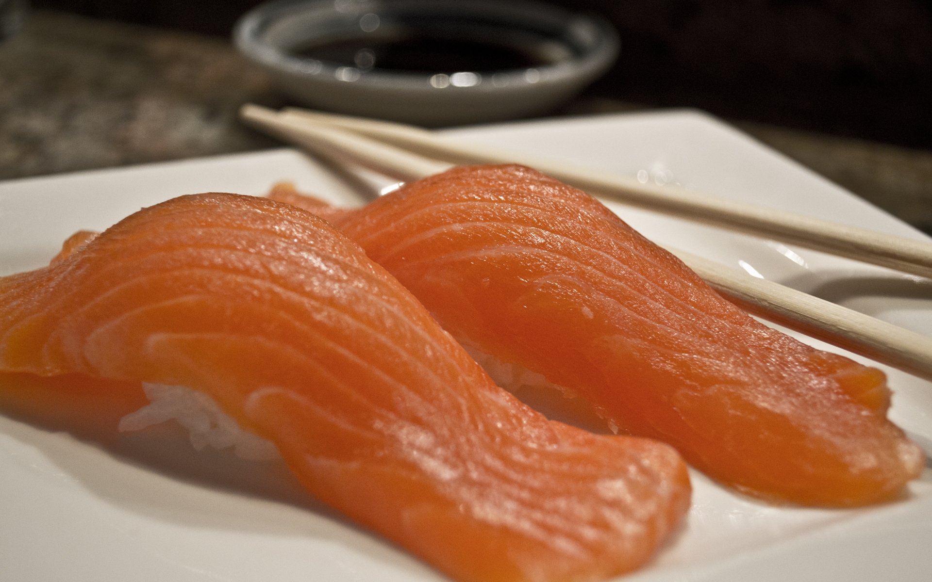HD PC desktop wallpaper and background: close-up of two salmon nigiri sushi on a white plate with chopsticks and a soy sauce dish, food and fish.