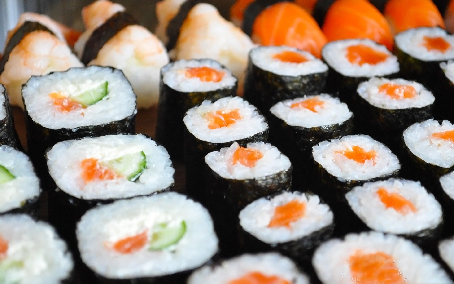 HD PC desktop wallpaper featuring close-up of assorted sushi rolls with vibrant colors and fresh ingredients.
