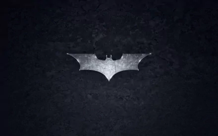 A sleek HD wallpaper featuring the iconic Batman symbol, centered on a dark backdrop, capturing the essence of the superhero and his signature batarang.