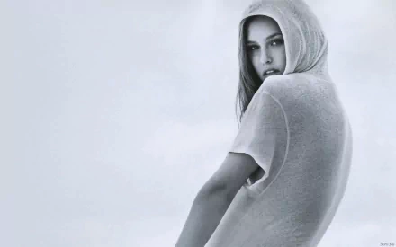 HD desktop wallpaper featuring celebrity Bar Refaeli in a soft, hooded outfit against a muted background.