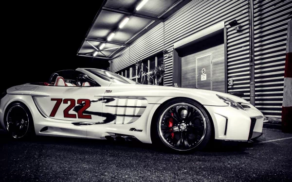 A sleek Mercedes-Benz SLR McLaren, adorned with the number 722, parked in a modern garage setting, shown in an HD desktop wallpaper style.