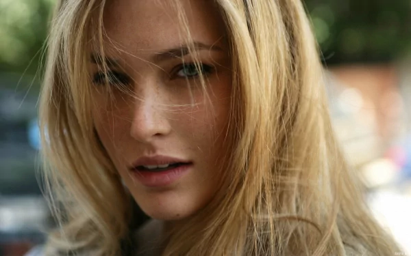 Close-up HD desktop wallpaper of celebrity Bar Refaeli with soft lighting and natural background blur.