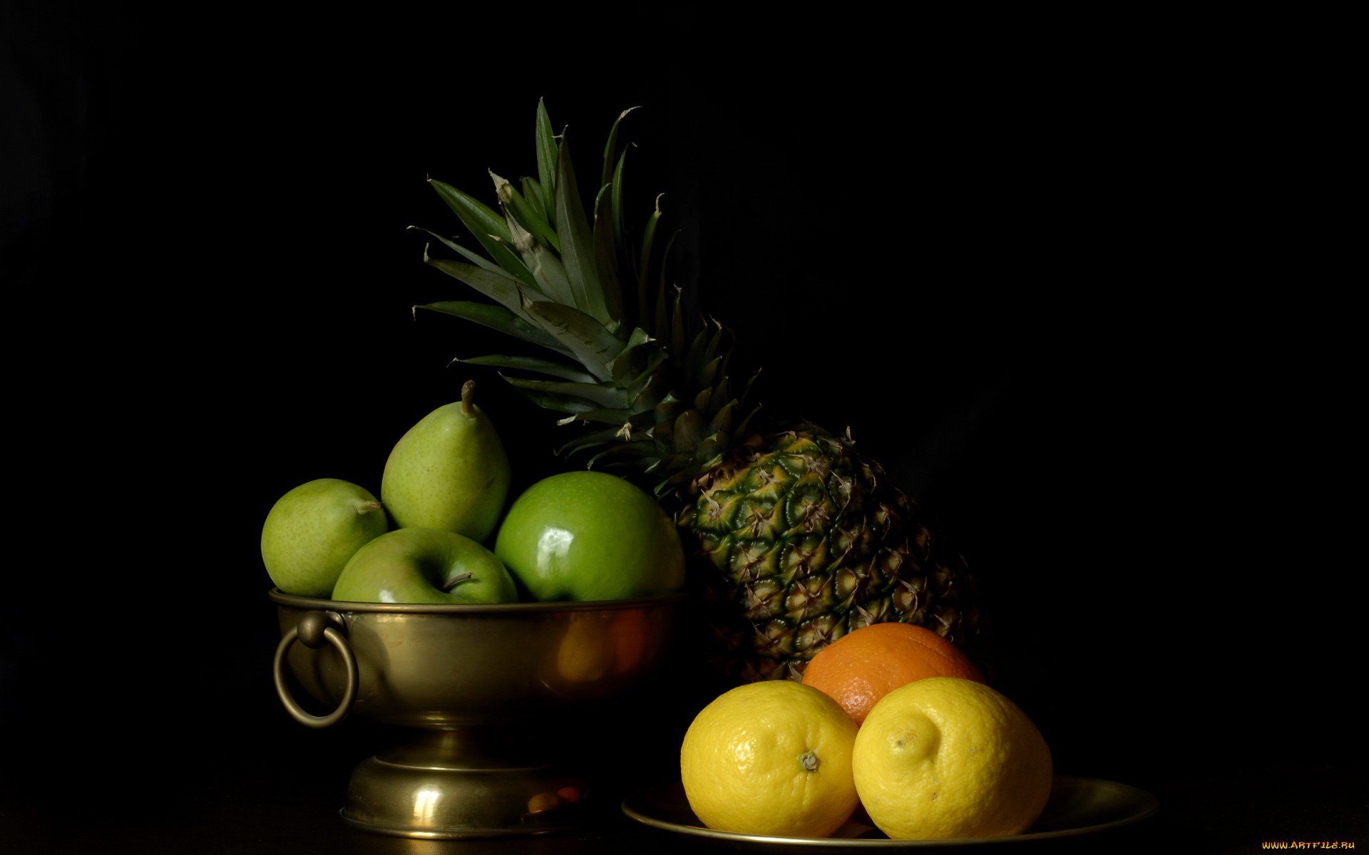 HD PC desktop wallpaper featuring a still life of green apples in a brass bowl, a pineapple, and citrus fruits against a dark background.