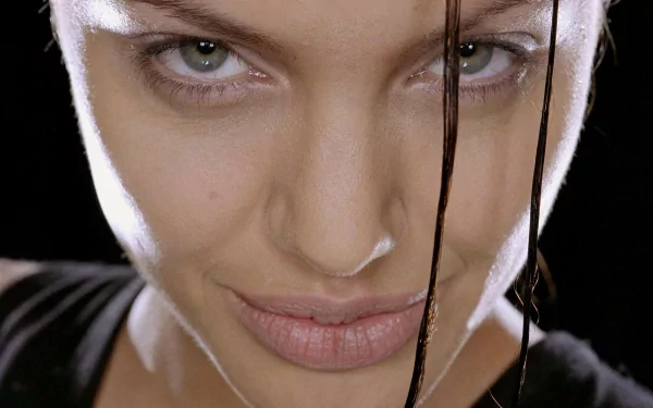 Close-up of Lara Croft from the movie Lara Croft: Tomb Raider, featured as an HD PC desktop wallpaper and background.