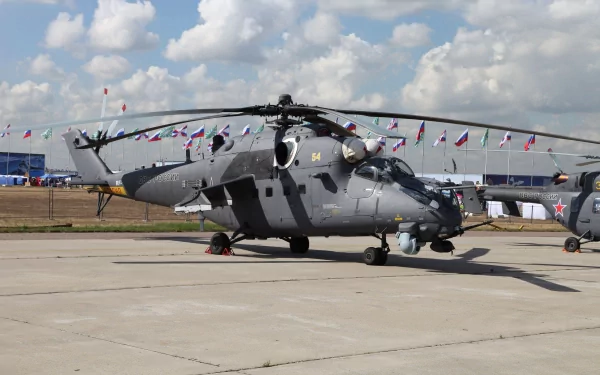 A Mil Mi-35 military helicopter parked on a tarmac under a partly cloudy sky, captured in 4K Ultra HD for a PC desktop wallpaper.
