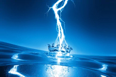 An abstract HD desktop wallpaper featuring a striking electric blue background, with a dramatic lightning bolt striking a water surface, creating a dynamic splash.