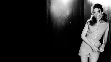 A striking black-and-white HD wallpaper featuring Scarlett Johansson, exuding elegance and confidence against a dark backdrop. A captivating choice for any desktop background.