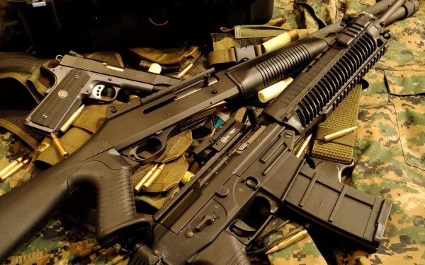 HD desktop wallpaper featuring a close-up of man-made assault rifles resting on military gear with a camouflage background.