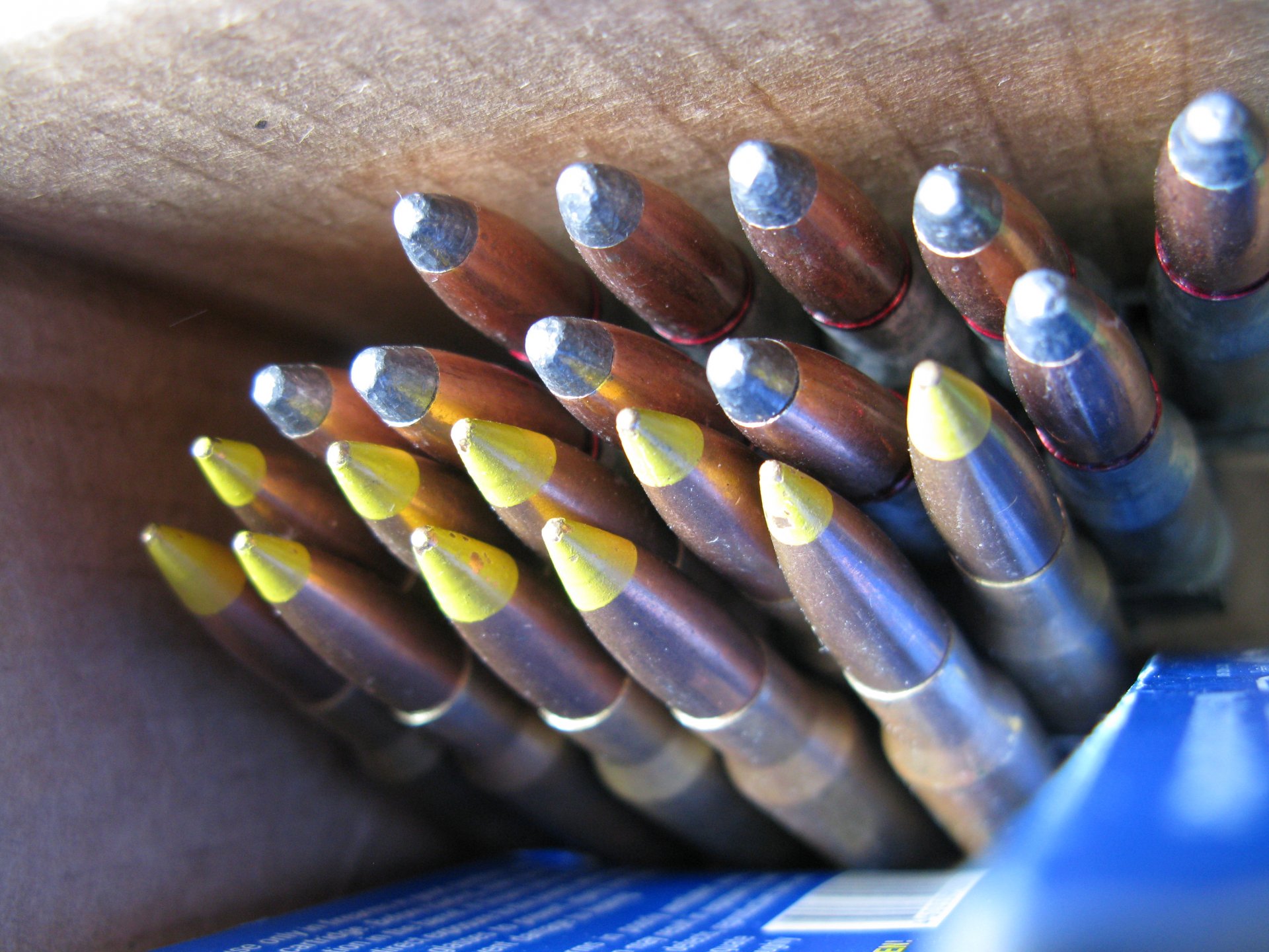 Close-up of man-made bullets arranged in rows, captured in sharp detail for a 4K Ultra HD PC desktop wallpaper and background.