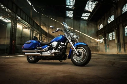 Blue Yamaha Roadstar motorcycle parked inside a spacious industrial building, captured in HD quality as a PC desktop wallpaper and background.