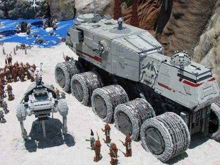 HD PC desktop wallpaper featuring a detailed man-made LEGO model of a large sci-fi vehicle and robot in a desert-like setting.