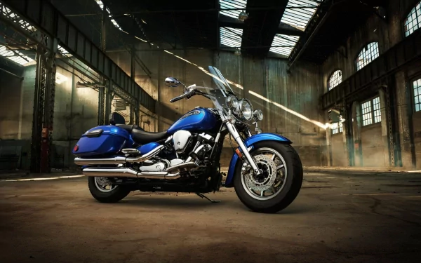 Blue Yamaha Roadstar motorcycle parked inside a spacious industrial building, captured in HD quality as a PC desktop wallpaper and background.