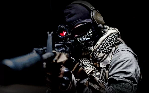 A gritty, high-definition wallpaper from Call of Duty: Modern Warfare 2, featuring a masked soldier aiming a rifle in a dark, dramatic setting.