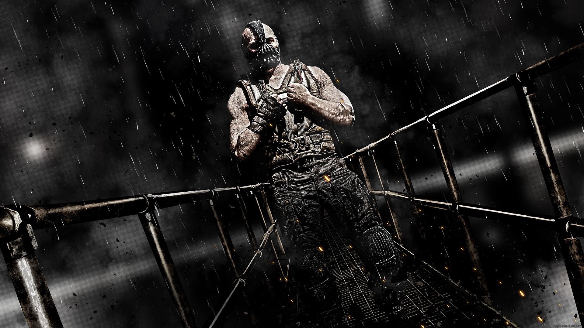 HD PC desktop wallpaper and background: Bane from the movie The Dark Knight Rises, masked muscular figure on a rain-soaked metal catwalk under dramatic, stormy lighting.