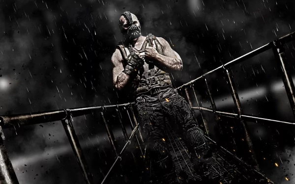 HD PC desktop wallpaper and background: Bane from the movie The Dark Knight Rises, masked muscular figure on a rain-soaked metal catwalk under dramatic, stormy lighting.