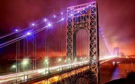 HD desktop wallpaper featuring the illuminated George Washington Bridge in New York against a vibrant, colorful night sky.
