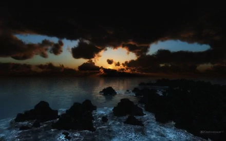 Artistic night scene of a rocky shoreline under a dramatic sky, captured in HD as a PC desktop wallpaper and background.