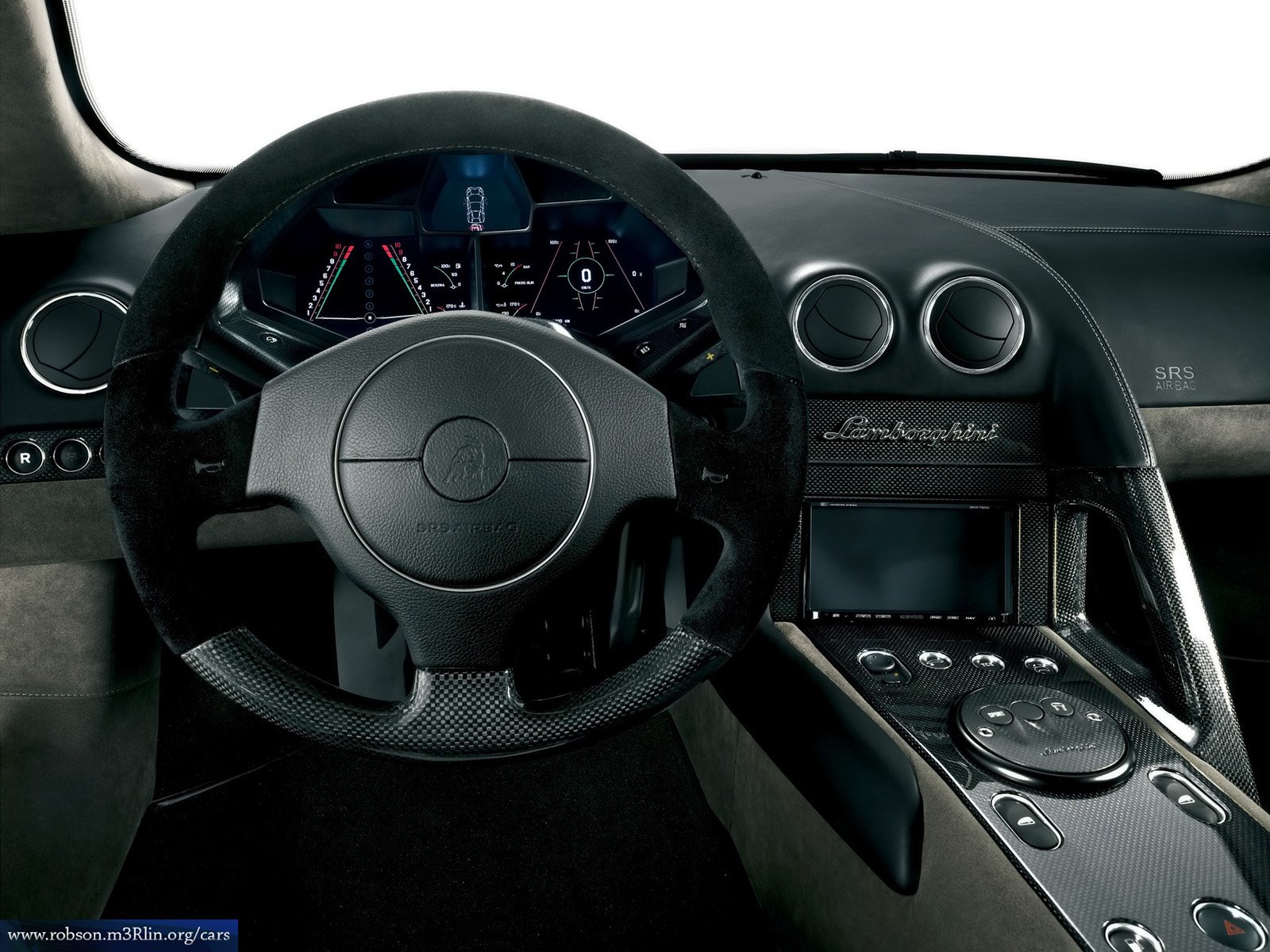 HD desktop wallpaper showing the interior dashboard and steering wheel of a Lamborghini Reventón.