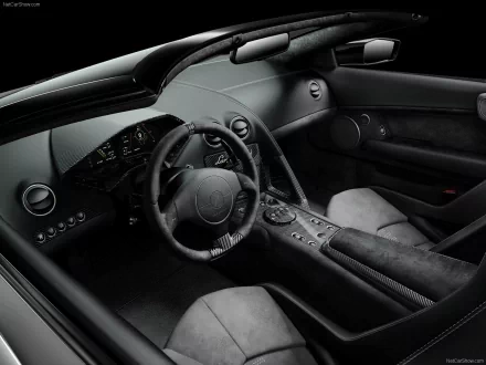 HD desktop wallpaper of the sleek interior of a Lamborghini Reventón with a focus on the steering wheel and dashboard.