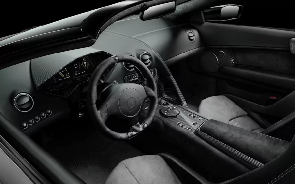 HD desktop wallpaper of the sleek interior of a Lamborghini Reventón with a focus on the steering wheel and dashboard.