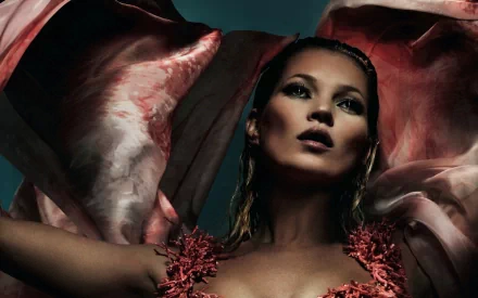 HD desktop wallpaper featuring a striking portrait of celebrity Kate Moss with flowing fabric creating a dramatic backdrop.