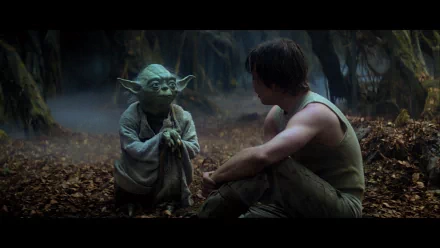 HD desktop wallpaper of Yoda and Luke Skywalker from Star Wars Episode V: The Empire Strikes Back, set in a misty forest.