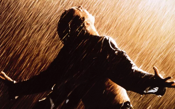HD desktop wallpaper of a scene from The Shawshank Redemption with a person in the rain, arms outstretched, embodying freedom.