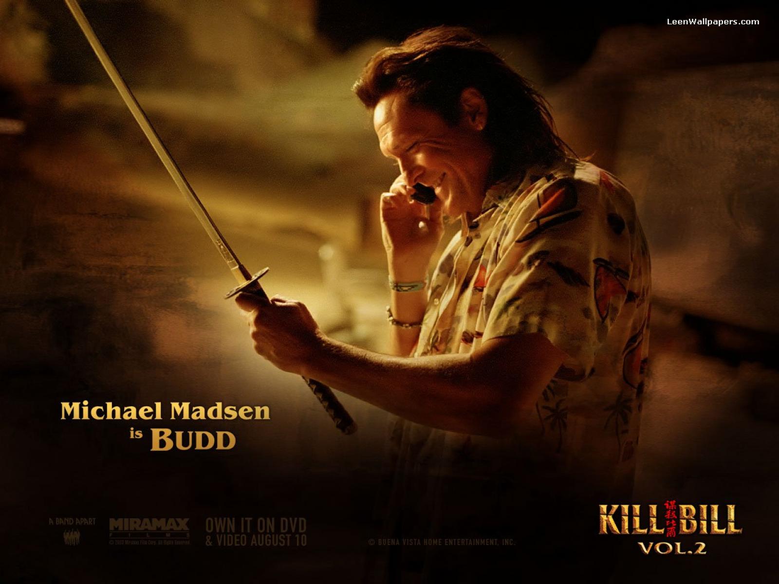 HD wallpaper featuring Michael Madsen as Budd from Kill Bill: Vol. 2, with a sword, against a dimly lit backdrop.
