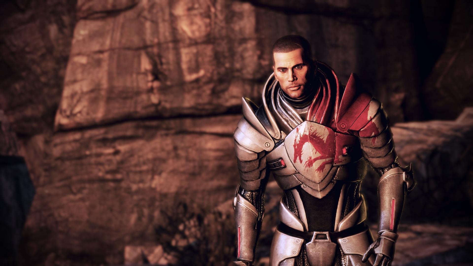 HD PC desktop wallpaper featuring Commander Shepard from the video game Mass Effect 3, standing in detailed armor against a rocky background.