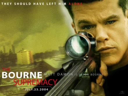 HD wallpaper of The Bourne Supremacy featuring Matt Damon as Jason Bourne with a scoped rifle, in a yellow-toned action-packed backdrop.