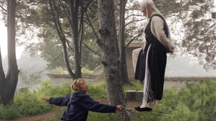 HD desktop wallpaper from Kill Bill: Vol. 2 featuring a confrontation between two characters in a misty forest setting.