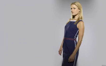 HD desktop wallpaper featuring celebrity Ali Larter standing in a navy blue dress against a light gray background.