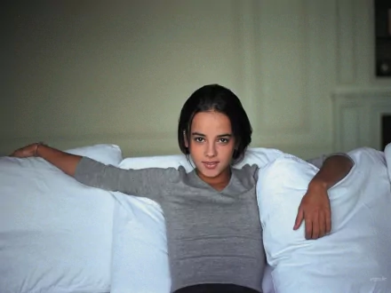 HD PC desktop wallpaper featuring Alizée, poised and relaxed, embodying a calm and musical ambiance.