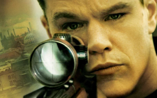 HD desktop wallpaper featuring a focused close-up from The Bourne Supremacy with a character peering through a sniper scope.