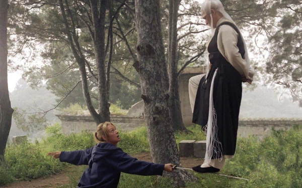 HD desktop wallpaper from Kill Bill: Vol. 2 featuring a confrontation between two characters in a misty forest setting.