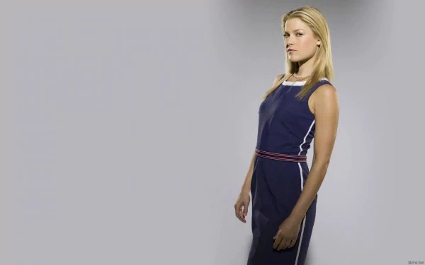 HD desktop wallpaper featuring celebrity Ali Larter standing in a navy blue dress against a light gray background.