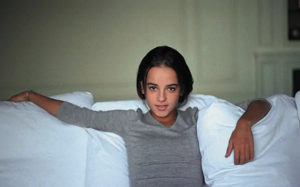HD PC desktop wallpaper featuring Alizée, poised and relaxed, embodying a calm and musical ambiance.