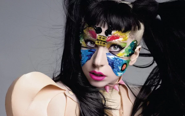 HD PC desktop wallpaper featuring Lady Gaga with vibrant butterfly face paint, blending music and bold artistic expression.