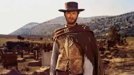 Clint Eastwood stands in a rugged landscape in this HD wallpaper for The Good, the Bad and the Ugly, embodying the essence of the iconic Western film.