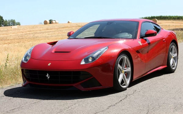 Red Ferrari F12berlinetta parked outdoors, HD desktop wallpaper and background.