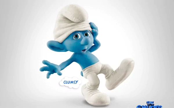 HD desktop wallpaper featuring Clumsy Smurf from The Smurfs movie. The character is seen in a playful stance, against a clean background. The Smurfs logo is at the bottom right corner.