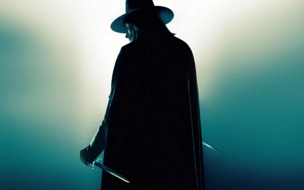 A striking HD wallpaper featuring a mysterious figure in a dark cloak and hat from the movie V for Vendetta, poised with a knife against a dramatic background.