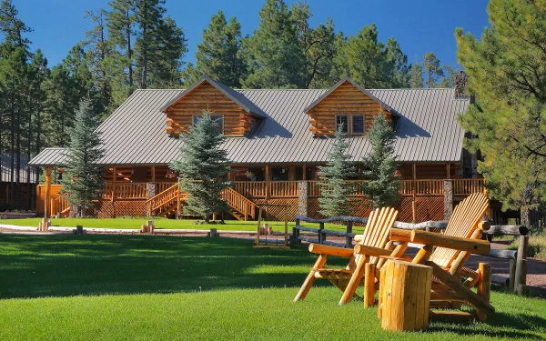 A beautifully designed wooden house nestled among tall trees, featuring a spacious deck and inviting outdoor seating, showcased in a vibrant 4K Ultra HD backdrop.