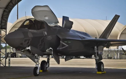Lockheed Martin F-35 Lightning II military jet parked on runway, shown in high-definition detail, designed as a PC desktop wallpaper and background image.
