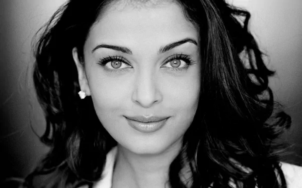 A stunning black and white HD desktop wallpaper featuring the celebrity Aishwarya Rai, showcasing her captivating smile and expressive eyes.