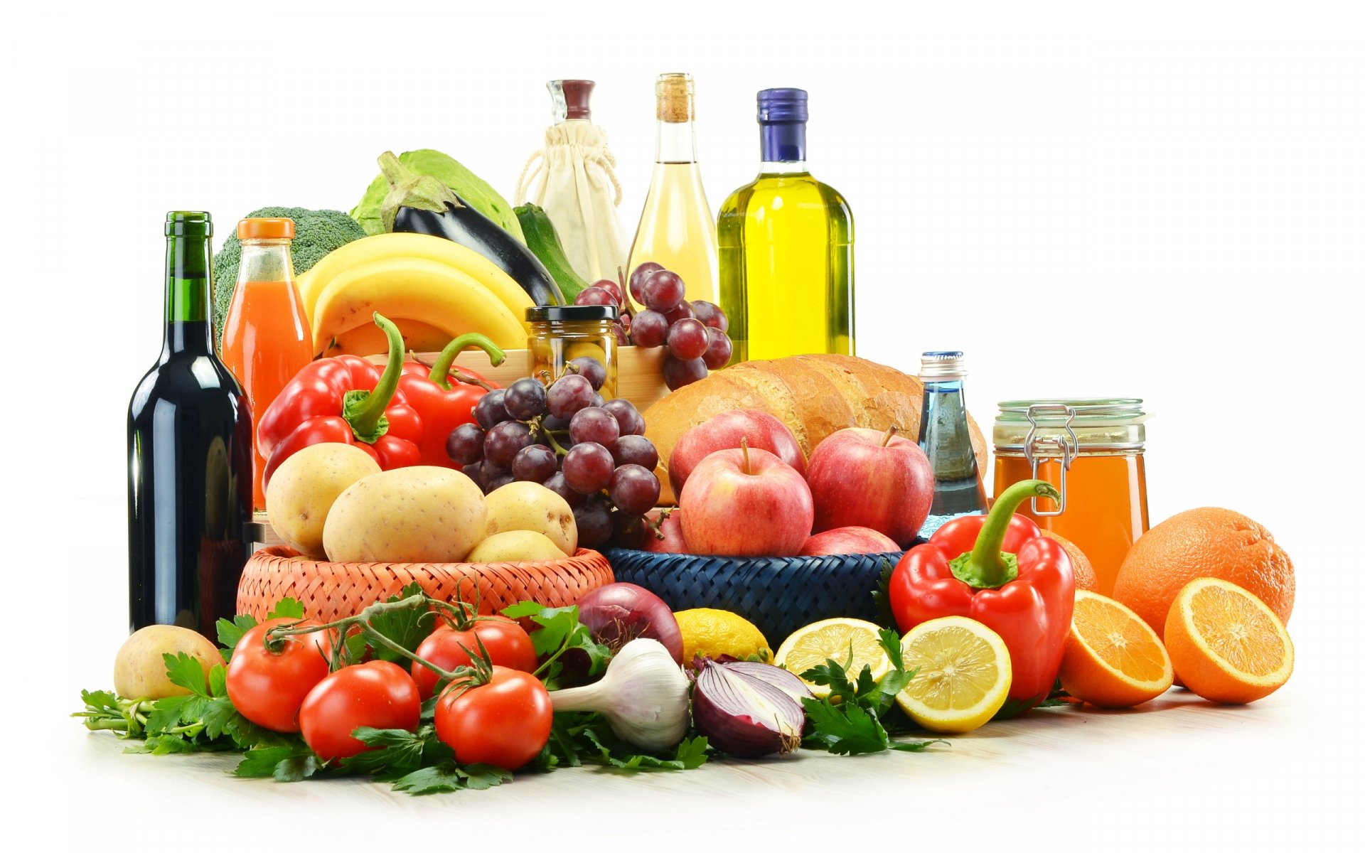 HD PC desktop wallpaper featuring a vibrant still life of assorted fresh fruits, vegetables, olive oil, and bottles arranged on a white background.