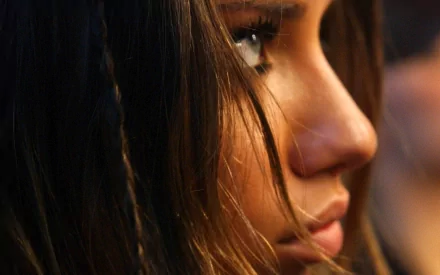 Close-up side profile of a person with long hair, detailed in high definition, tagged as celebrity Adriana Lima. This image serves as an HD desktop wallpaper and background.