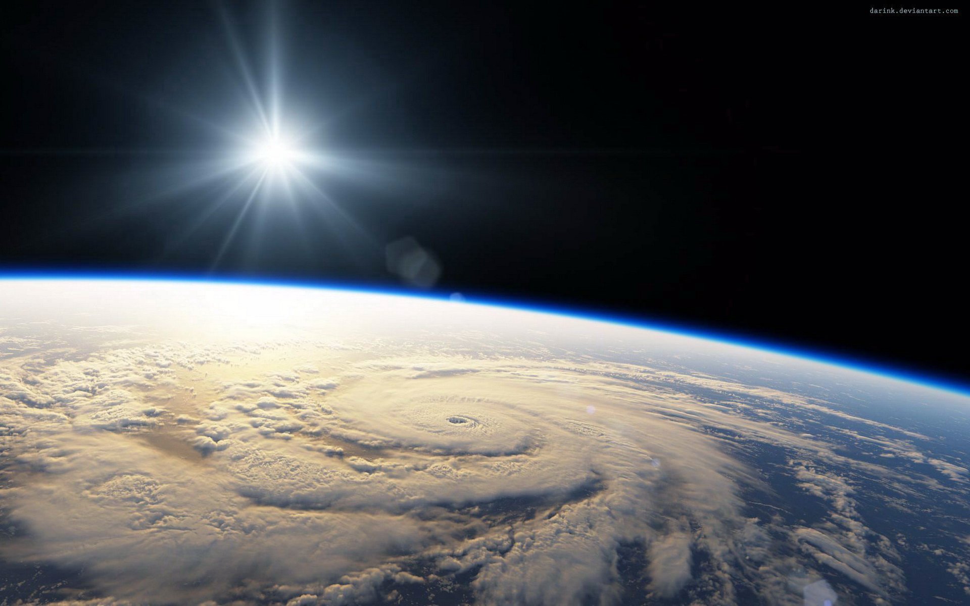HD desktop wallpaper showing a powerful cyclone swirling over Earth’s surface, captured from space with the sun shining brightly in the background.