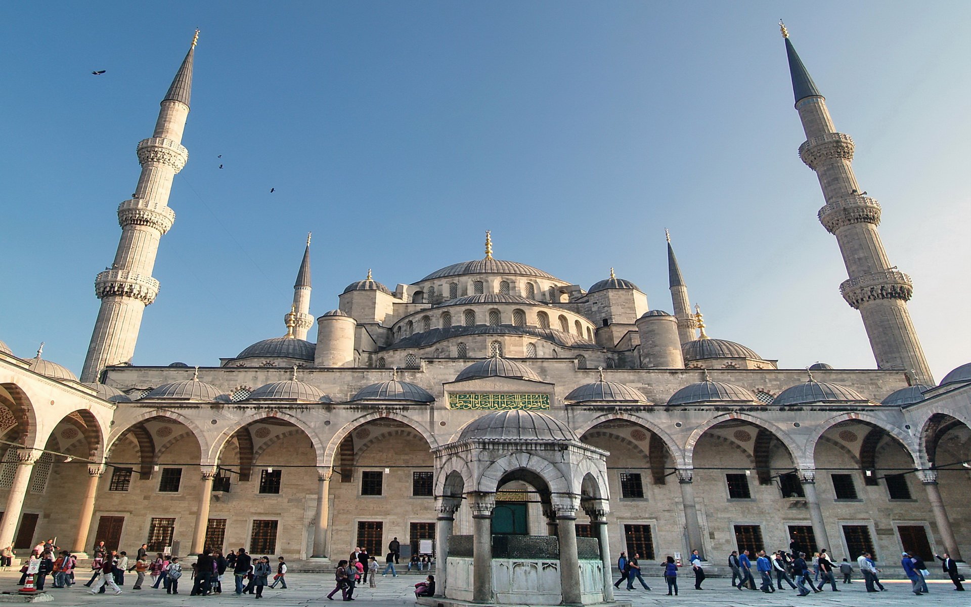 HD desktop wallpaper featuring the majestic Sultan Ahmed Mosque with its towering minarets under a clear blue sky, showcasing iconic religious architecture.