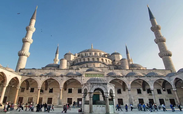 HD desktop wallpaper featuring the majestic Sultan Ahmed Mosque with its towering minarets under a clear blue sky, showcasing iconic religious architecture.